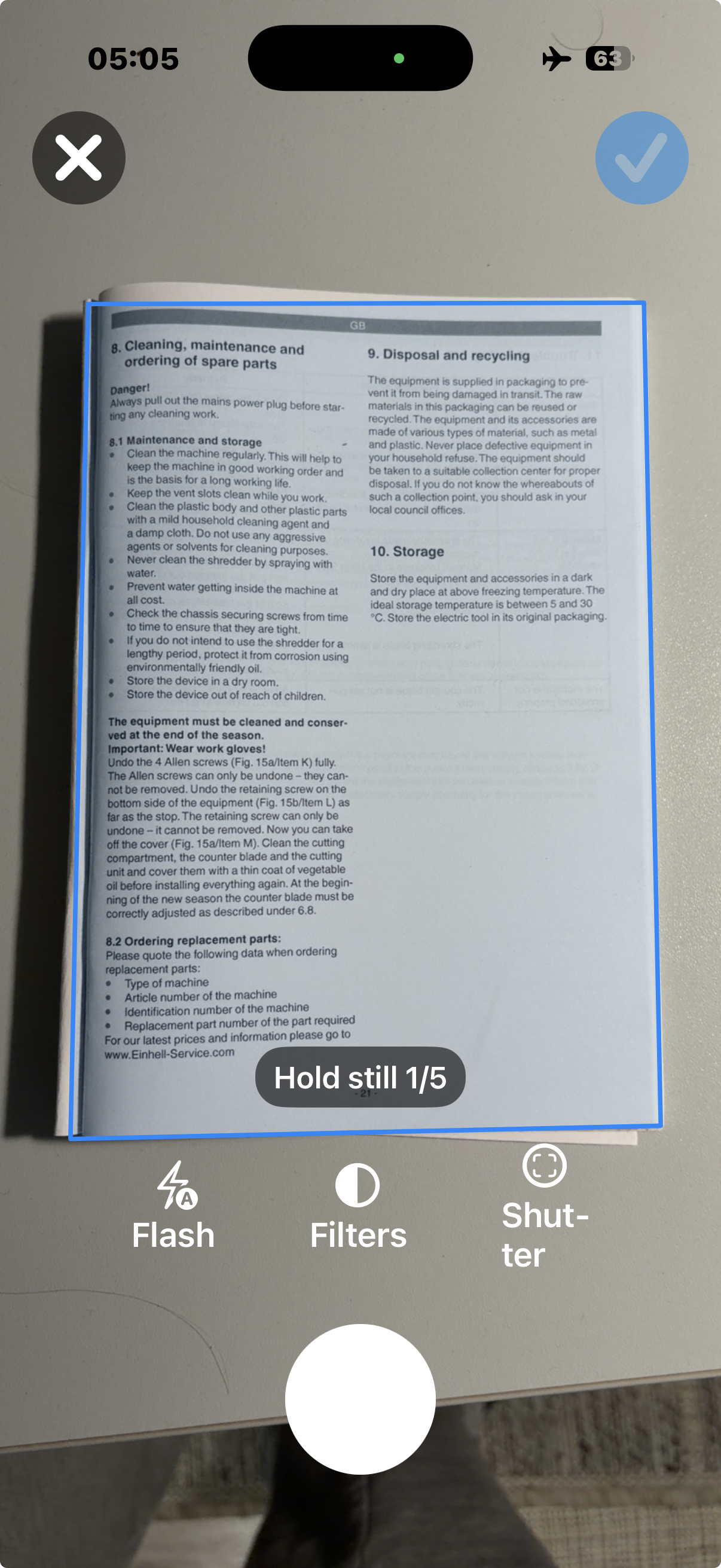 SimpleumSafe document scanner capture screen with a detected document outline and controls for flash, filters, and the shutter